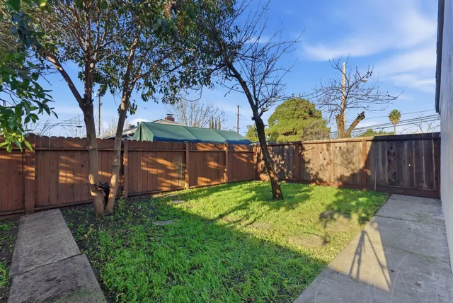 a backyard of a house with lots of green space