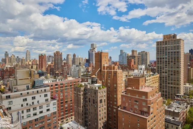 a view of a city with tall buildings