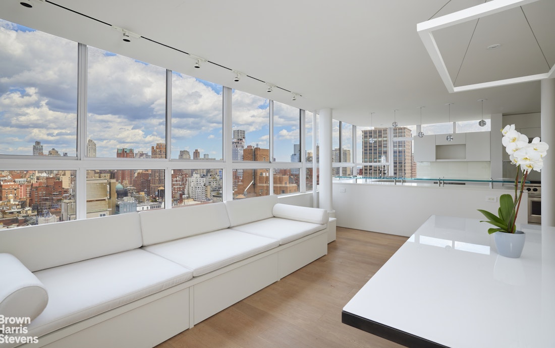 110 East 71st Street, Unit 19 Manhattan, NY 10021 - Photo 3 of 15 a large white room with a large window