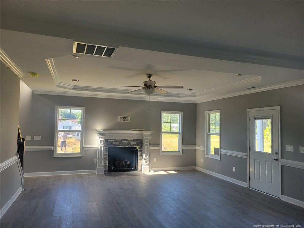2960 H H Clark Road Fayetteville, NC 28306 - Photo 13 of 33 an empty room with wooden floor fireplace and windows