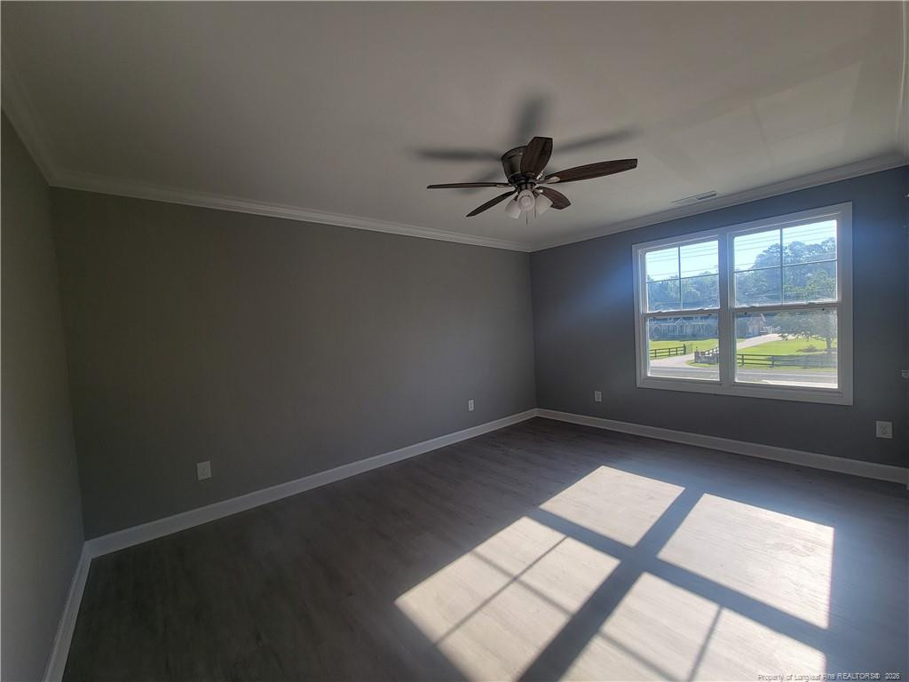 2960 H H Clark Road Fayetteville, NC 28306 - Photo 20 of 33 an empty room with windows and ceiling fan