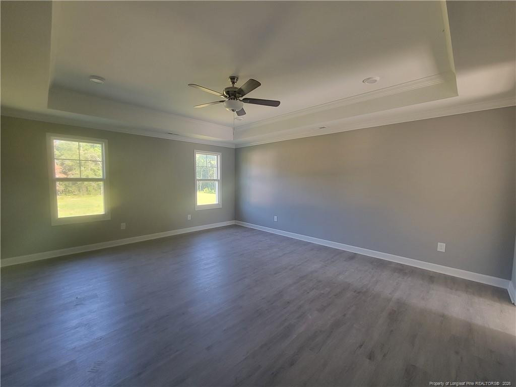 2960 H H Clark Road Fayetteville, NC 28306 - Photo 23 of 33 an empty room with wooden floor and windows