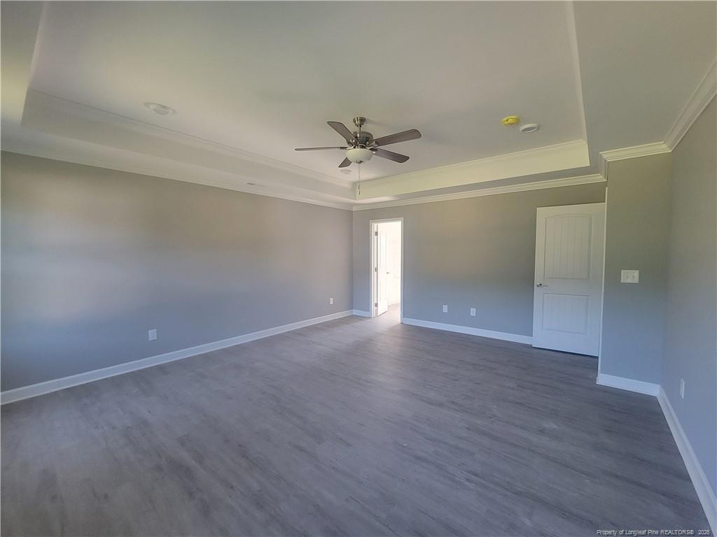 2960 H H Clark Road Fayetteville, NC 28306 - Photo 26 of 33 an empty room with wooden floor and fan