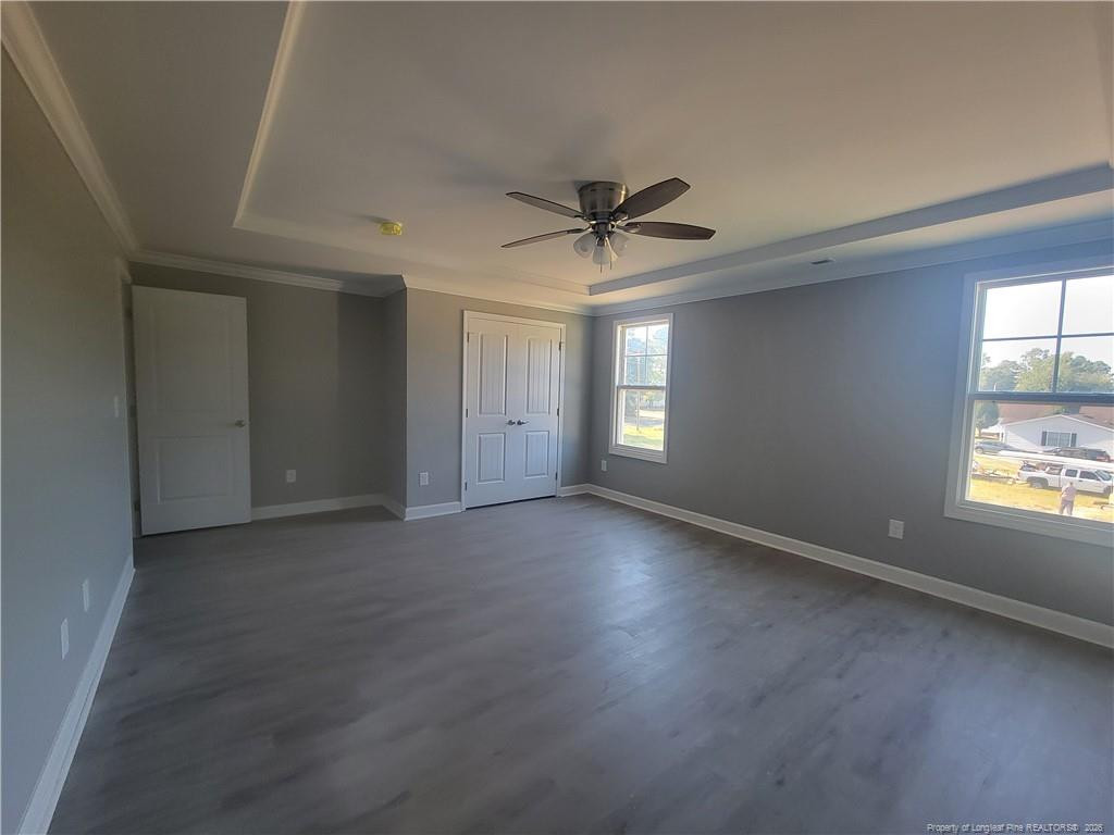 2960 H H Clark Road Fayetteville, NC 28306 - Photo 32 of 33 an empty room with a window and a ceiling fan