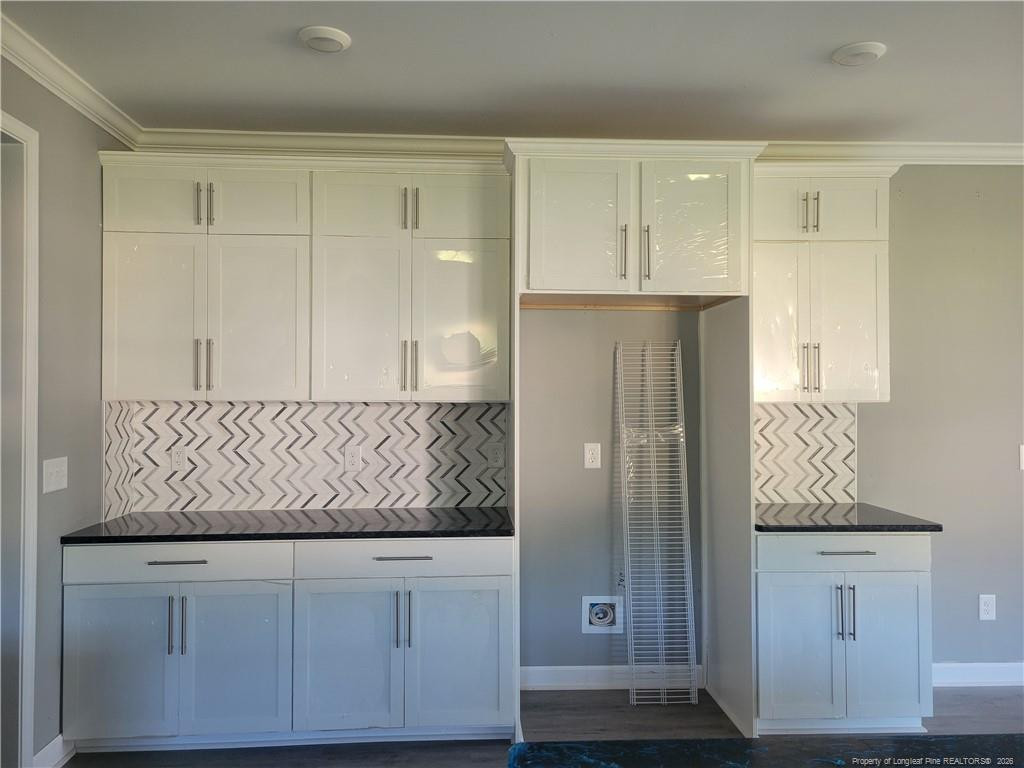 2960 H H Clark Road Fayetteville, NC 28306 - Photo 8 of 33 a view of cabinets and wooden floor