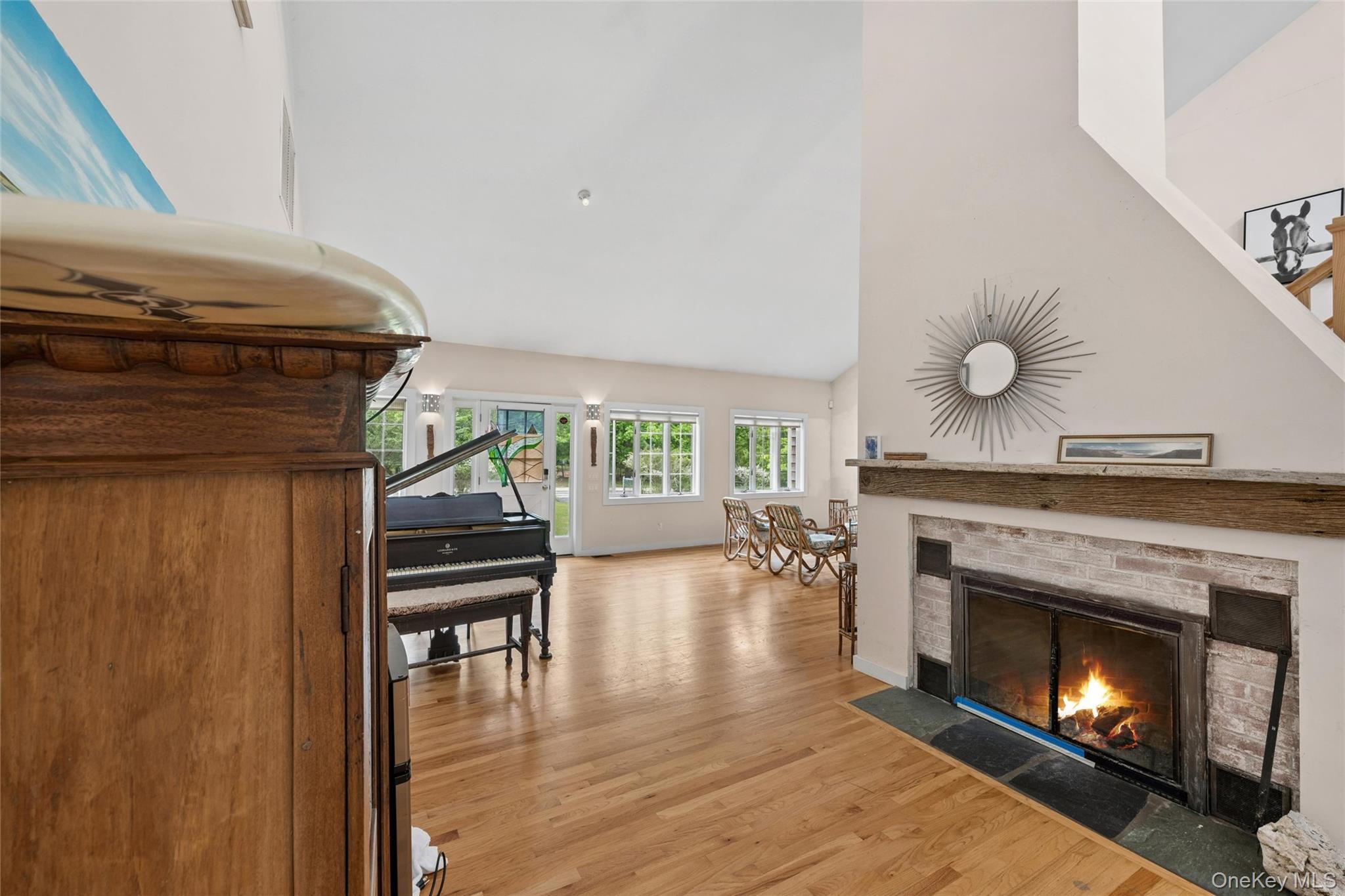 131 Red Creek Road Hampton Bays, NY 11946 - Photo 33 of 35 a living room with furniture and a fireplace