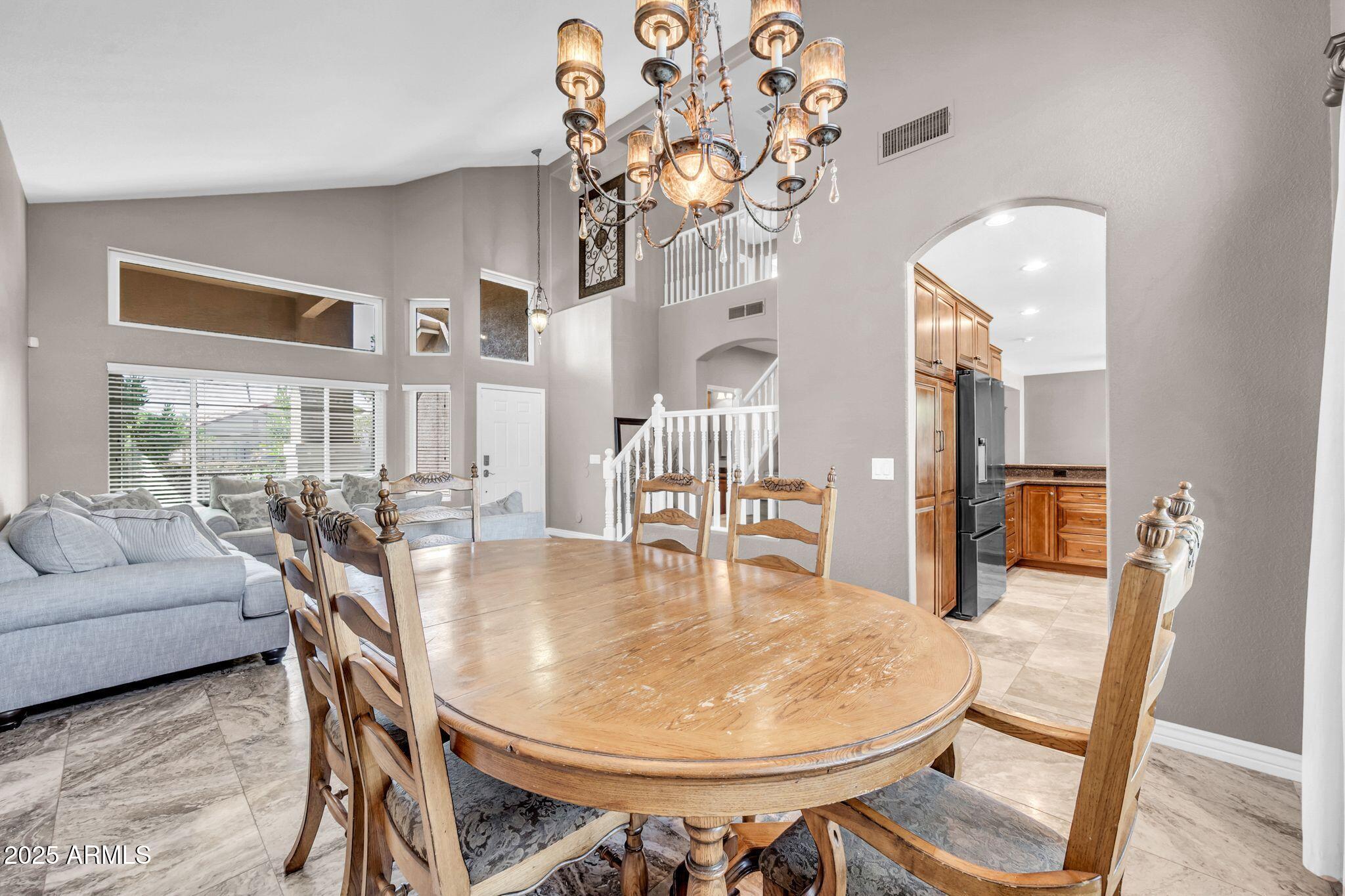 1302 West Winchester Way Chandler, AZ 85224 - Photo 10 of 61 a dining room with furniture and wooden floor