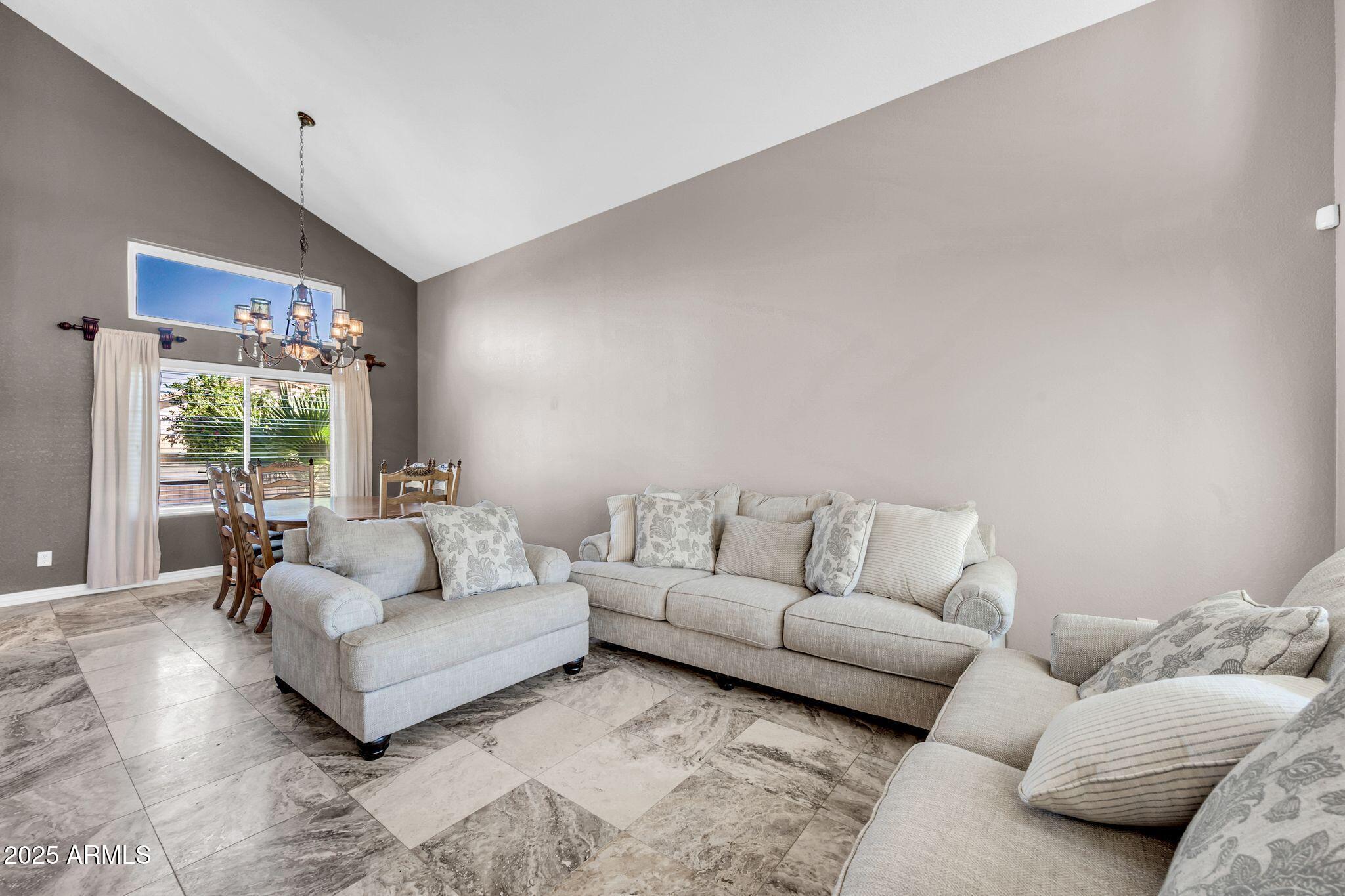 1302 West Winchester Way Chandler, AZ 85224 - Photo 12 of 61 a living room with furniture and a large window