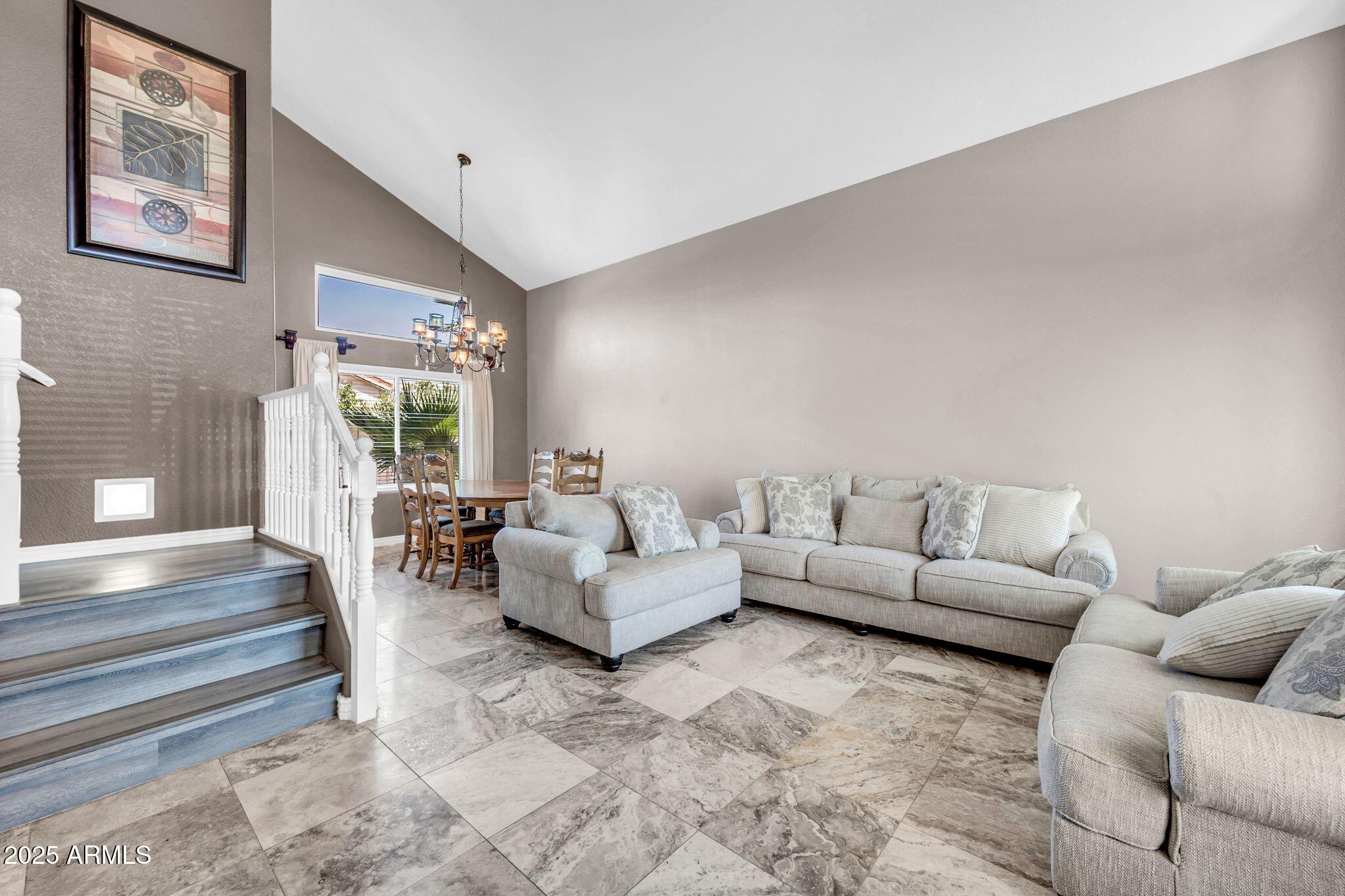 1302 West Winchester Way Chandler, AZ 85224 - Photo 13 of 61 a living room with furniture and a large window