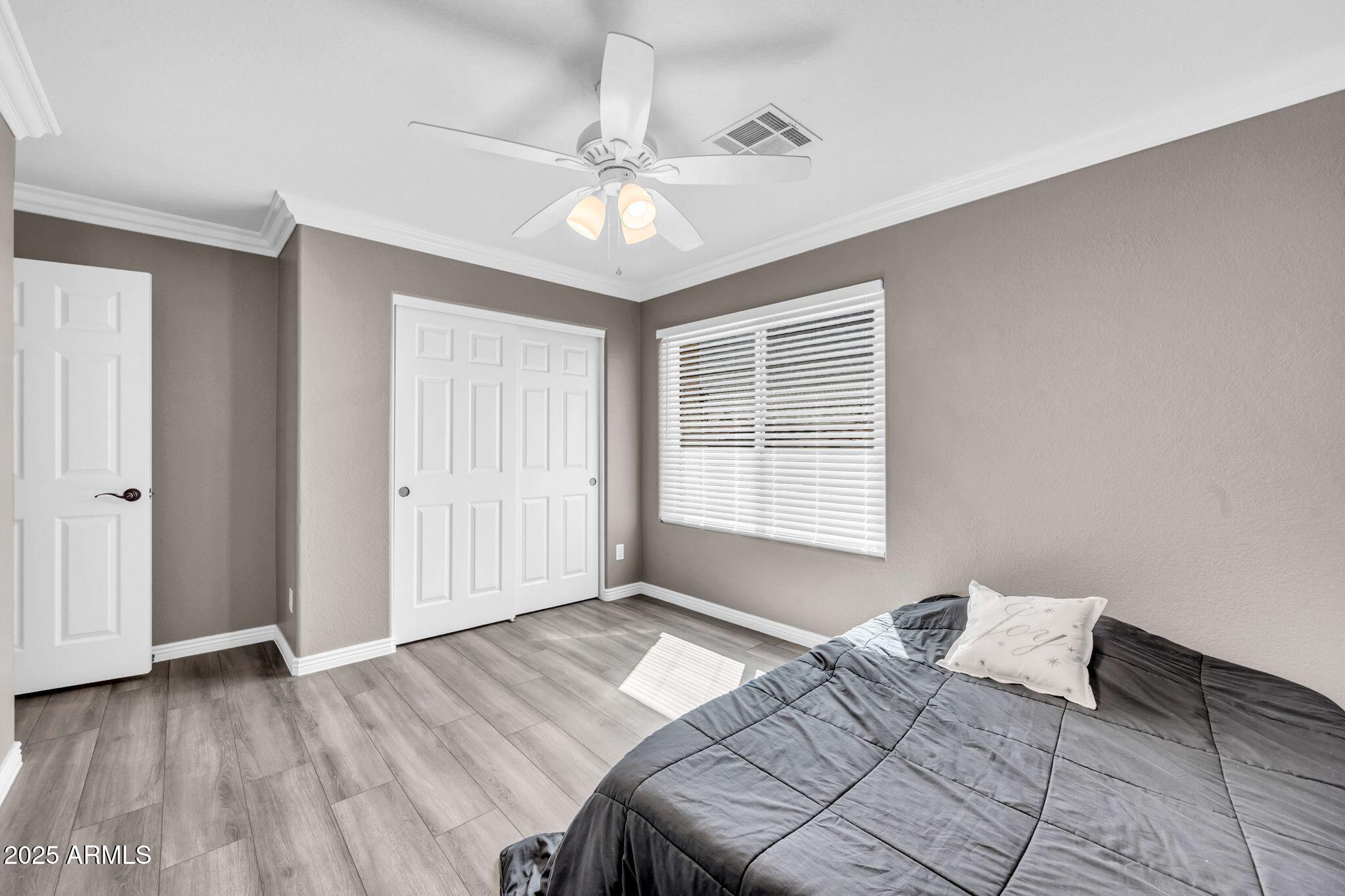 1302 West Winchester Way Chandler, AZ 85224 - Photo 26 of 61 a bedroom with a bed and a window