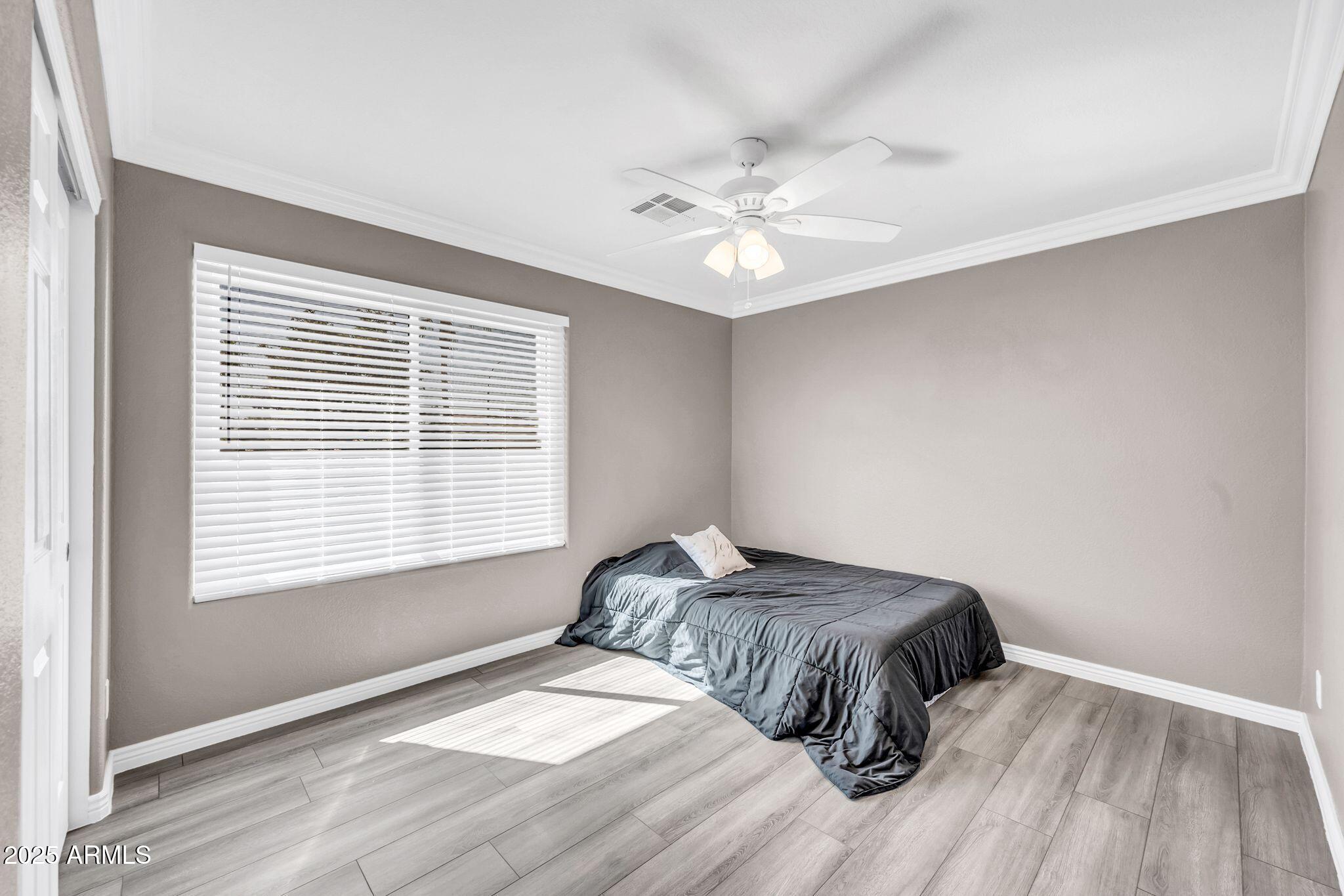 1302 West Winchester Way Chandler, AZ 85224 - Photo 27 of 61 a bedroom with a bed and a window