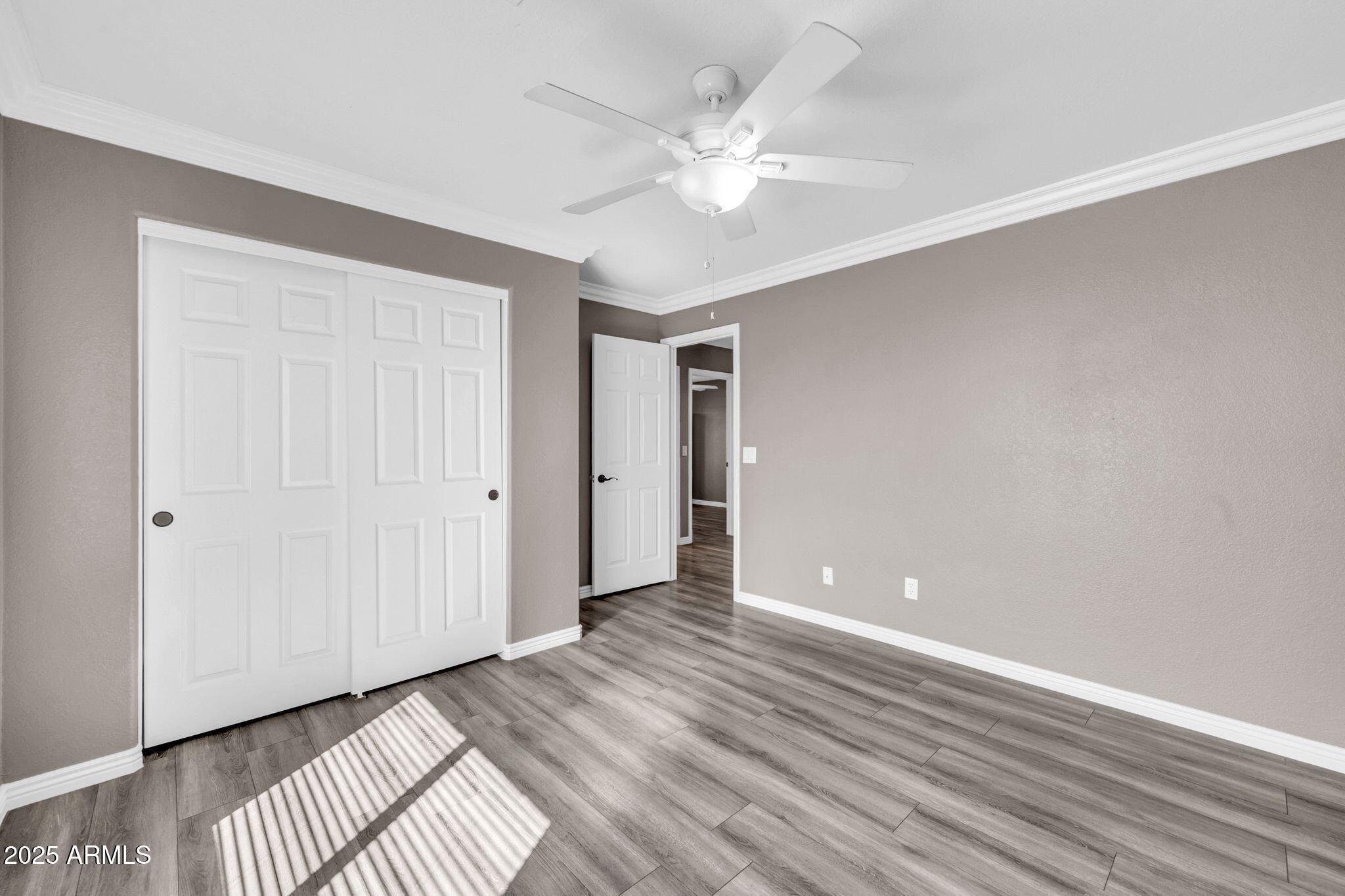 1302 West Winchester Way Chandler, AZ 85224 - Photo 28 of 61 wooden floor in an empty room with a window