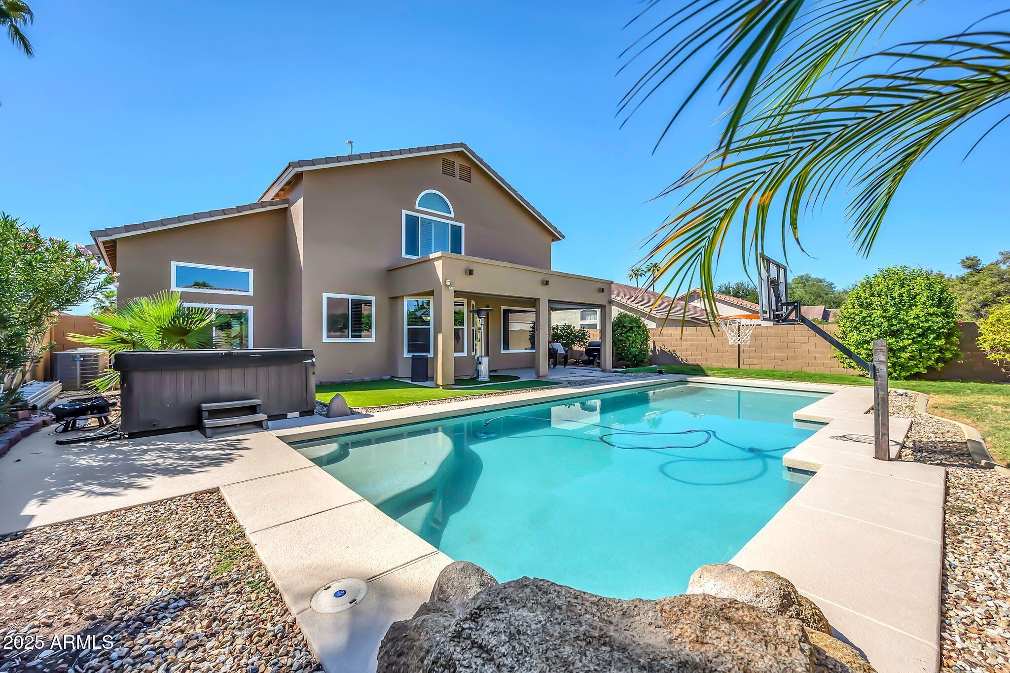 1302 West Winchester Way Chandler, AZ 85224 - Photo 2 of 61 a view of a house with swimming pool