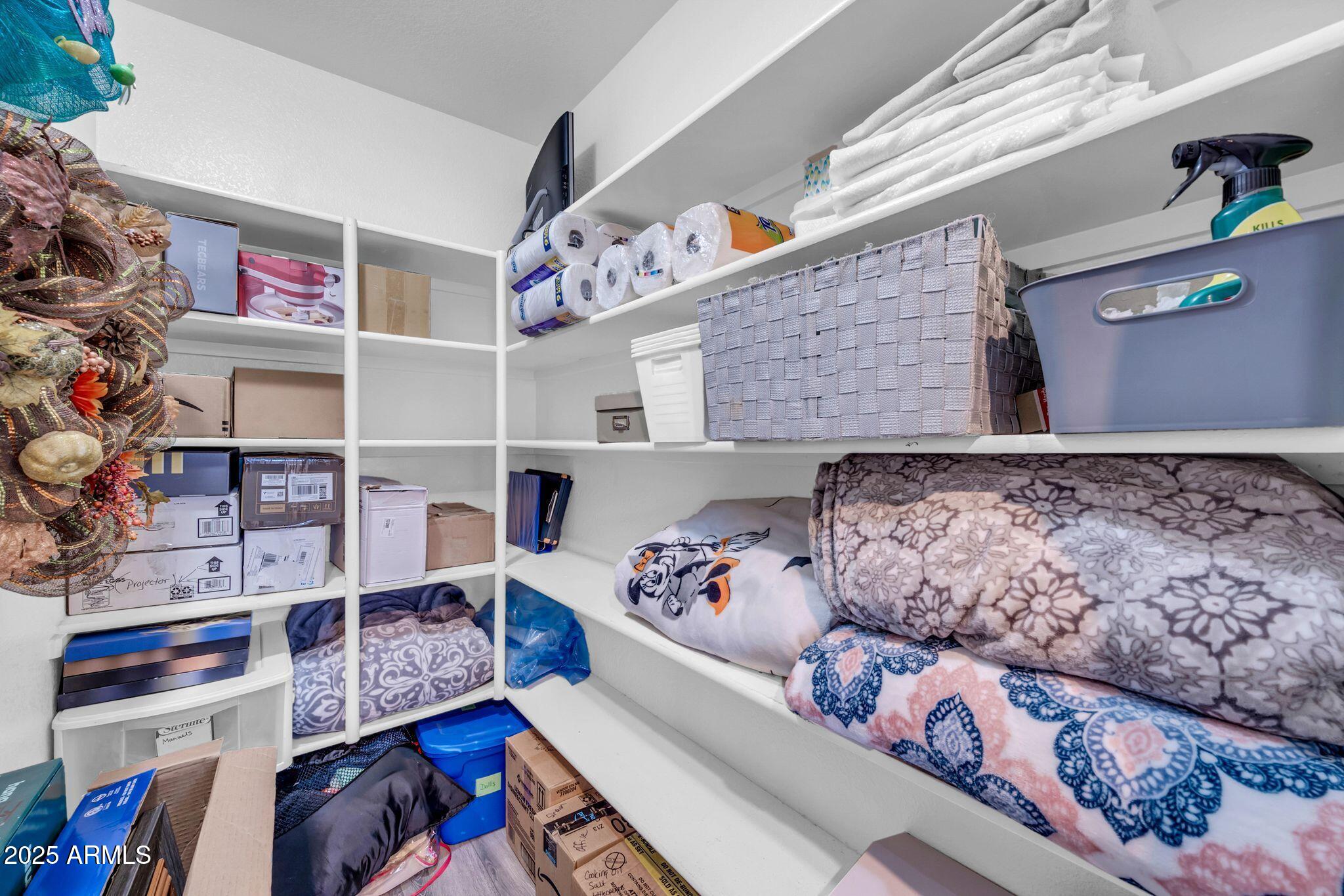 1302 West Winchester Way Chandler, AZ 85224 - Photo 30 of 61 a bed room with a bed and a book shelf