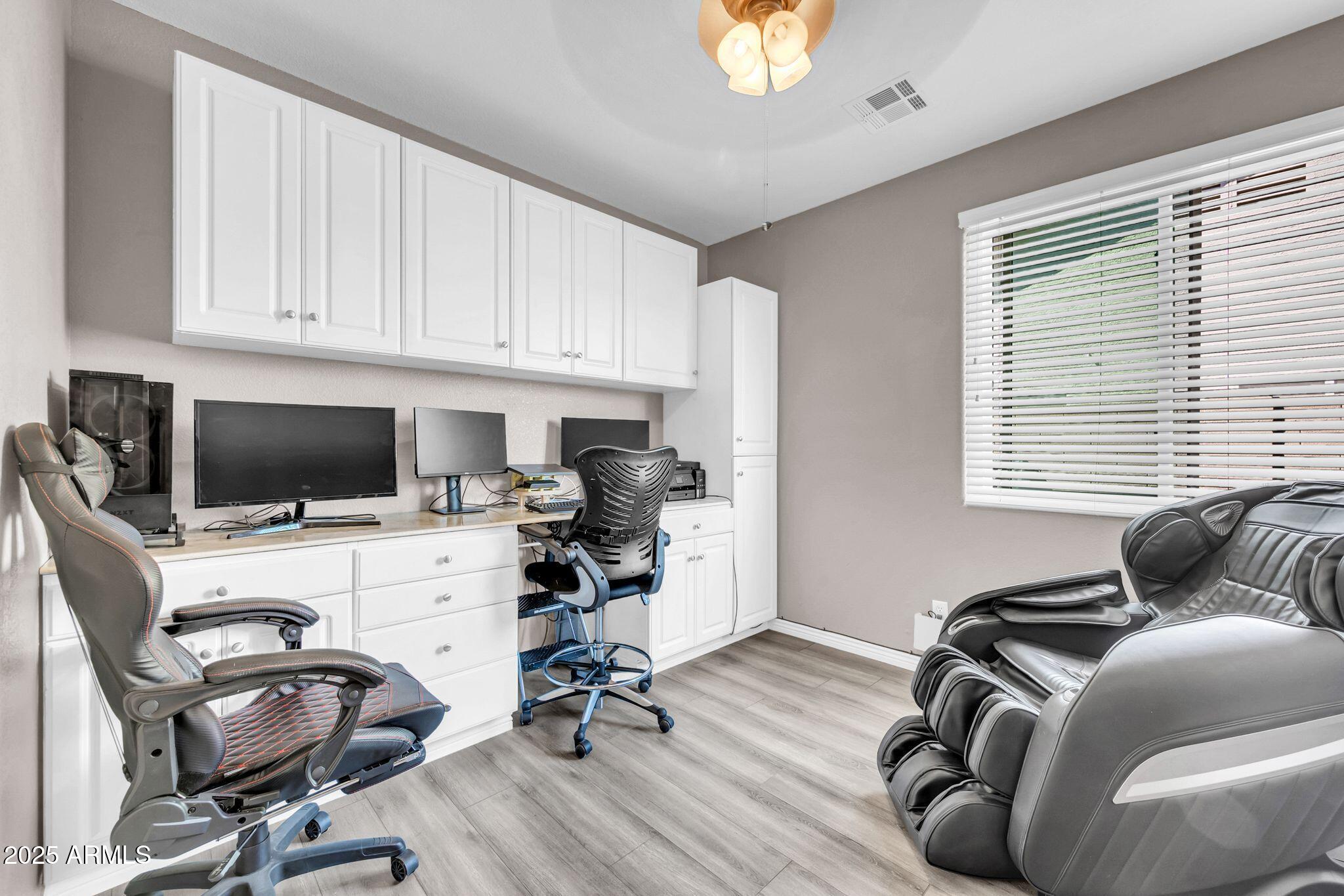 1302 West Winchester Way Chandler, AZ 85224 - Photo 35 of 61 a view of a workspace with furniture and a window