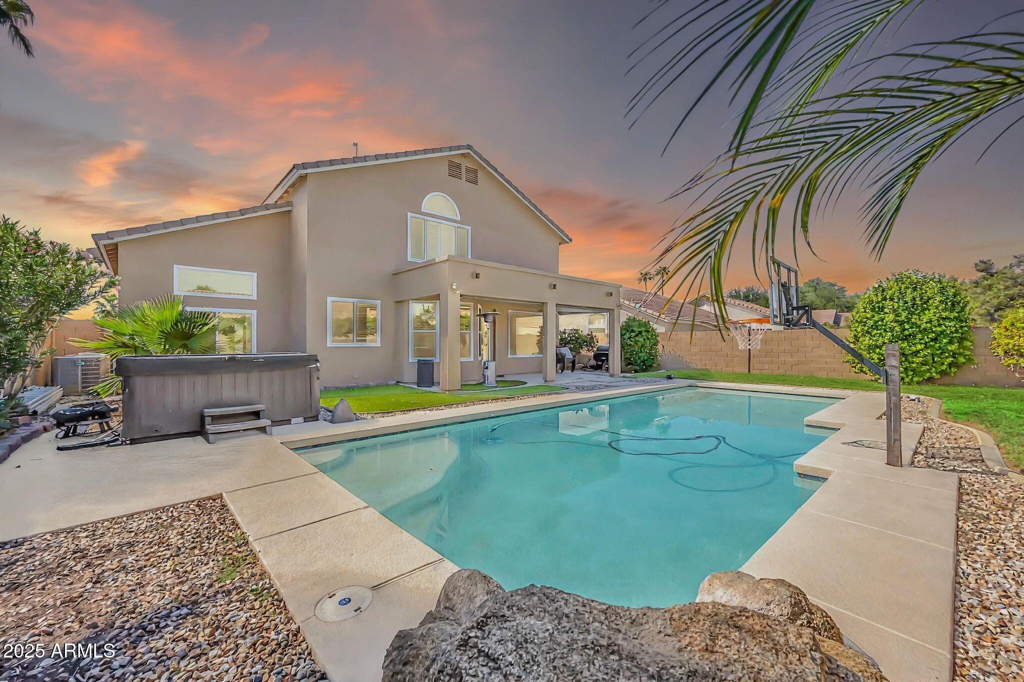 1302 West Winchester Way Chandler, AZ 85224 - Photo 45 of 61 a view of a house with a small yard and sitting area