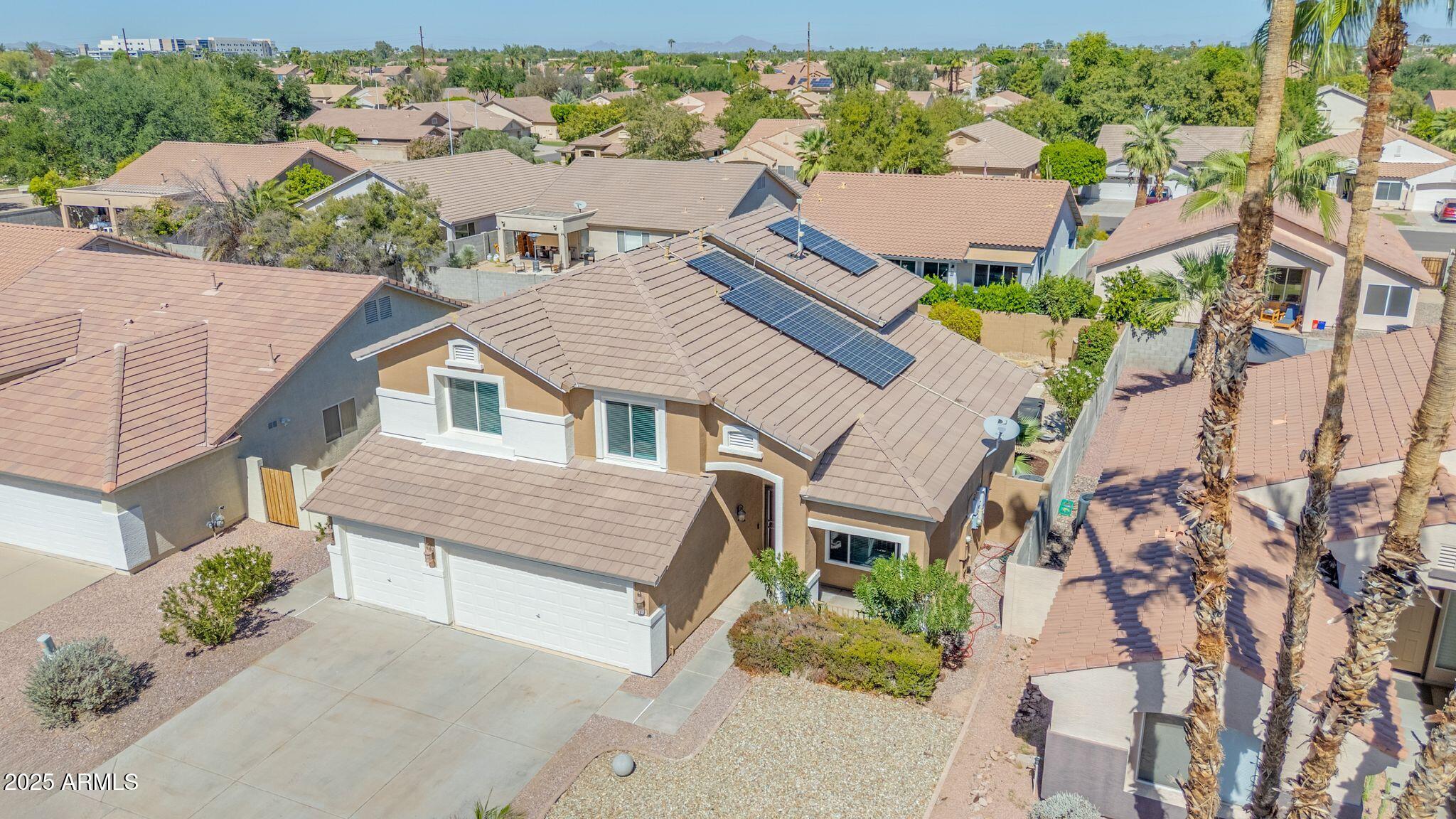 1302 West Winchester Way Chandler, AZ 85224 - Photo 49 of 61 an aerial view of multiple houses with a yard