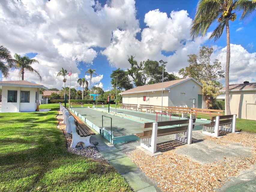 680 Horizon West, Unit 103 Boynton Beach, FL 33435 - Photo 23 of 61 a view of a house with a yard