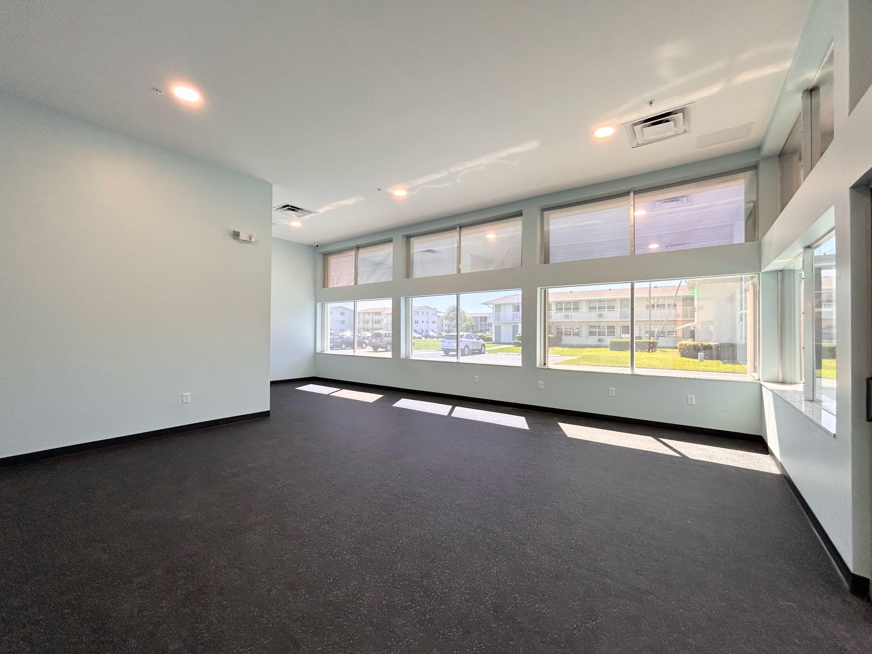 680 Horizon West, Unit 103 Boynton Beach, FL 33435 - Photo 49 of 61 a view of an empty room with a window