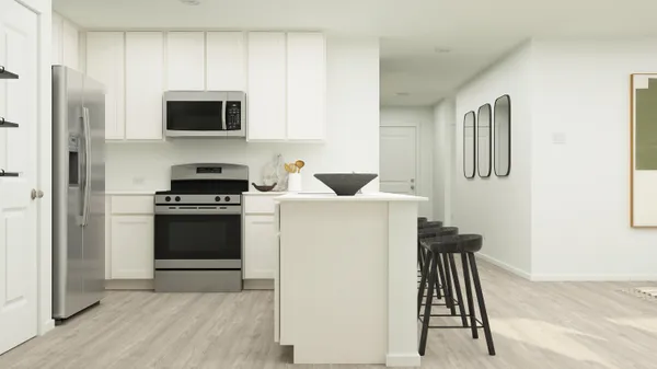 a kitchen with a refrigerator sink and stove