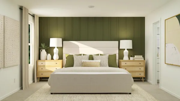 a bedroom with a bed and a painting on the wall