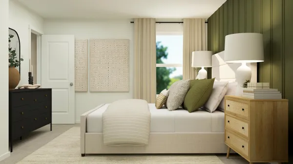 a bedroom with a bed and a lamp