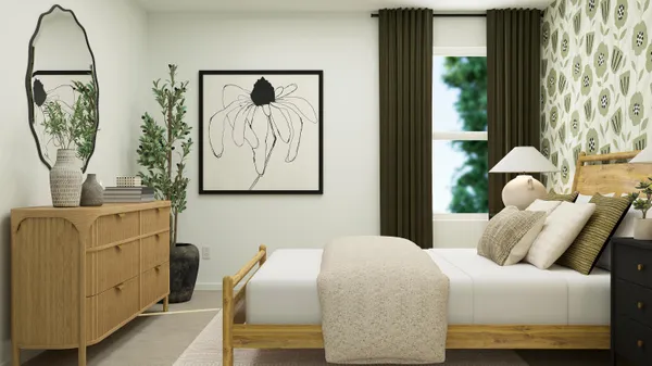 a bedroom with a bed and painting on the wall