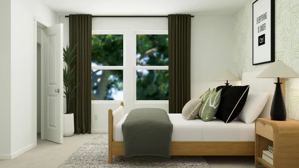 a bedroom with furniture and a window