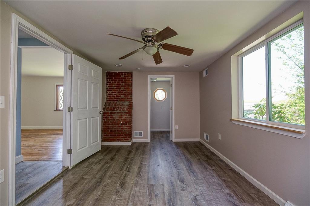 531 West Ingomar Road Pittsburgh, PA 15237 - Photo 13 of 35 a view of hallway with window and wooden floor