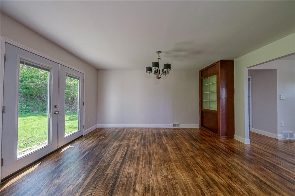 531 West Ingomar Road Pittsburgh, PA 15237 - Photo 9 of 35 a view of an empty room with wooden floor and a window