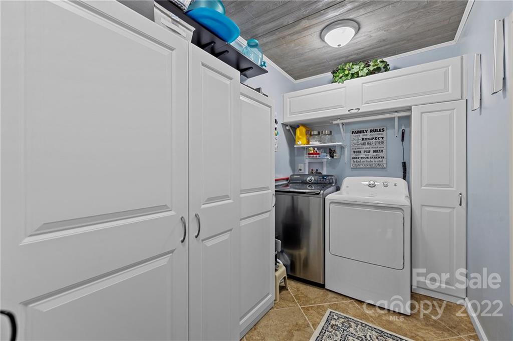 8241 Fairfield Forest Road Denver, NC 28037 - Photo 28 of 48 a utility room with dryer and washer