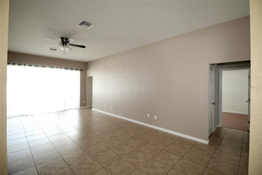 5739 Southwest 40th Street Ocala, FL 34474 - Photo 14 of 52 a view of an empty room with a window