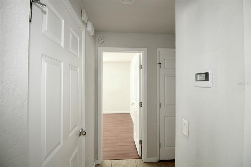 5739 Southwest 40th Street Ocala, FL 34474 - Photo 23 of 52 a view of a hallway with wooden floor and entryway