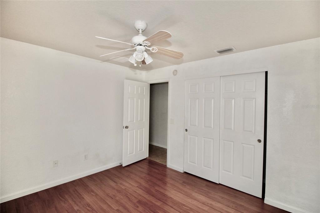 5739 Southwest 40th Street Ocala, FL 34474 - Photo 26 of 52 a view of an empty room with wooden floor