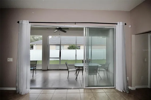 a view of a house with backyard and garden