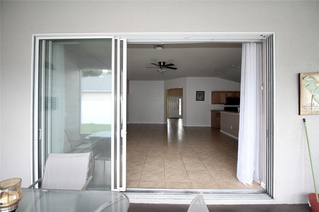 5739 Southwest 40th Street Ocala, FL 34474 - Photo 38 of 52 view of living room and kitchen view