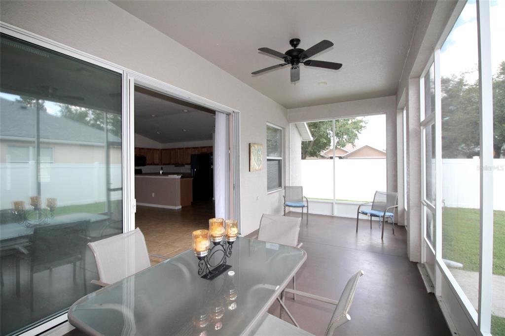5739 Southwest 40th Street Ocala, FL 34474 - Photo 40 of 52 a living room with furniture and a large window