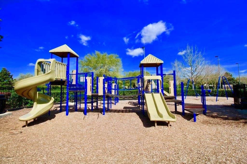 5739 Southwest 40th Street Ocala, FL 34474 - Photo 49 of 52 a view of a patio with a table and chairs under an umbrella