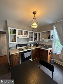 a kitchen with stainless steel appliances granite countertop a stove and a sink