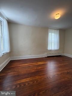 6232 Ridge Avenue Philadelphia, PA 19128 - Photo 11 of 20 an empty room with wooden floor and windows