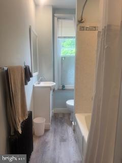 6232 Ridge Avenue Philadelphia, PA 19128 - Photo 14 of 20 a white toilet sitting next to a bathroom sink and a shower