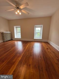 6232 Ridge Avenue Philadelphia, PA 19128 - Photo 8 of 20 an empty room with wooden floor chandelier fan and windows