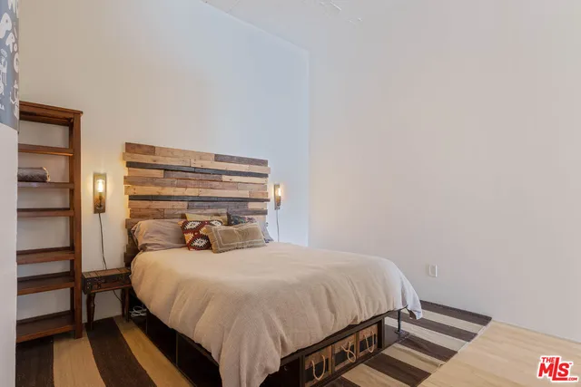 a bedroom with a bed and closet