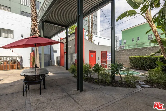 a view of a patio with a yard