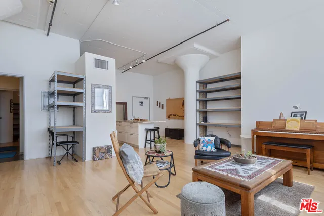 a work room with furniture and wooden floor