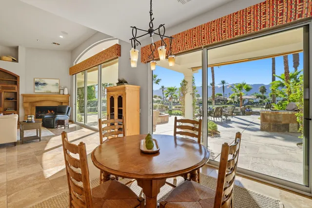 a bedroom with two beds and a lamp