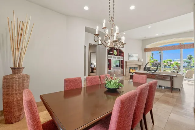 a bedroom with two beds and a large window