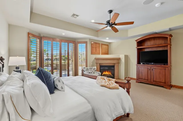 a bathroom with a granite countertop sink a mirror and a shower