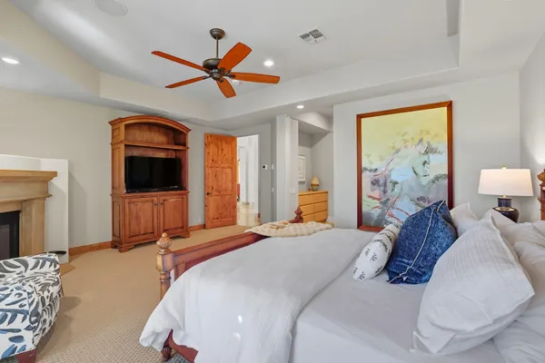 a bedroom with furniture and a window