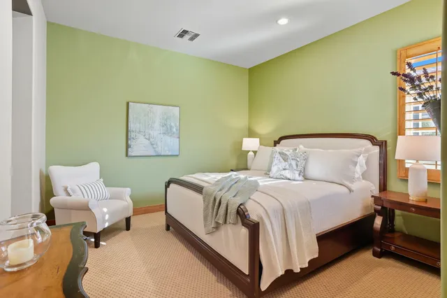 a view of a swimming pool with a table and chairs